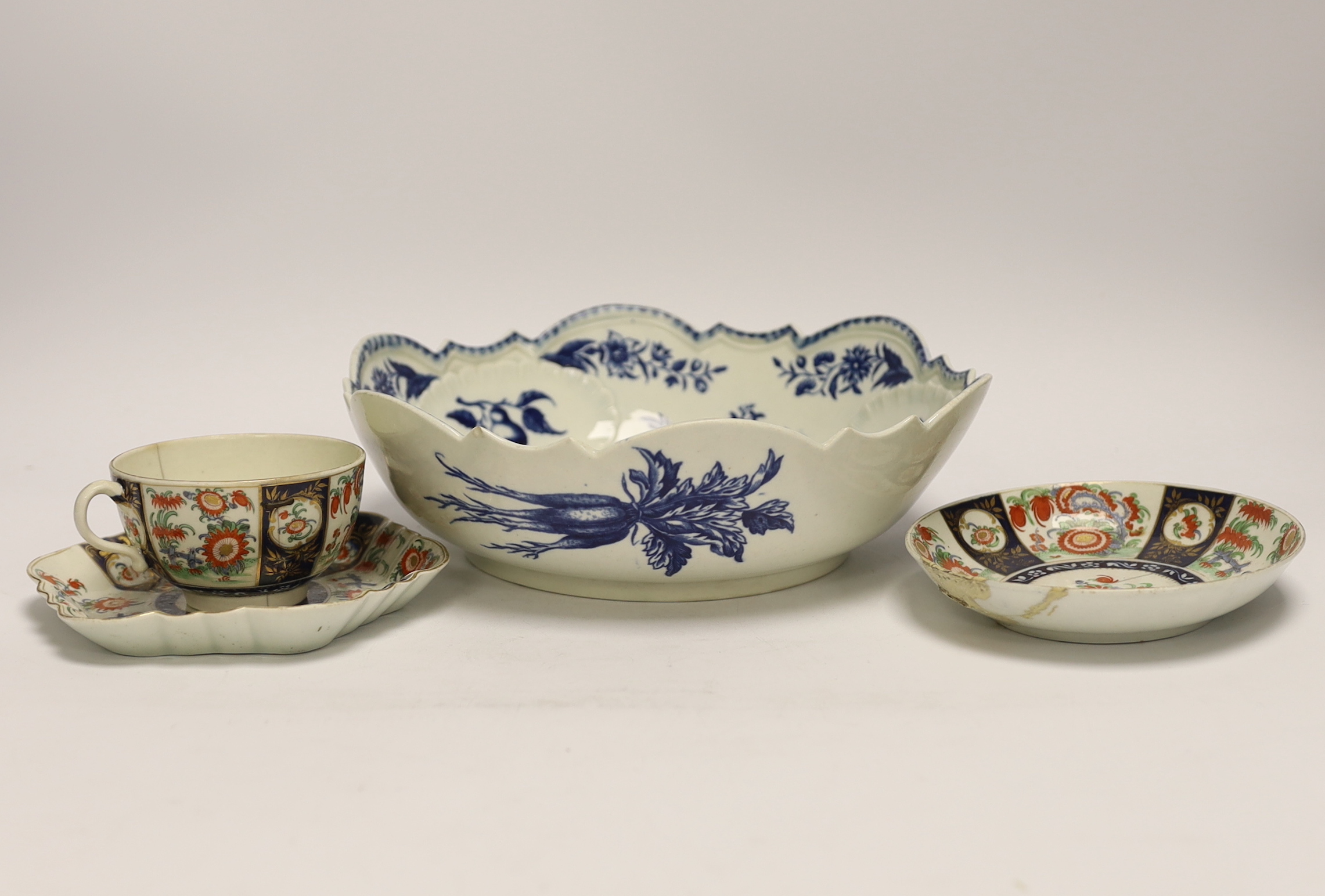 A Worcester Pine Cone pattern junket dish, c.1775, the shell moulded interior with other panels of fruit and flowers, the exterior printed with vegetables and a snail, shaded crescent mark, diameter 24.5cm Together with